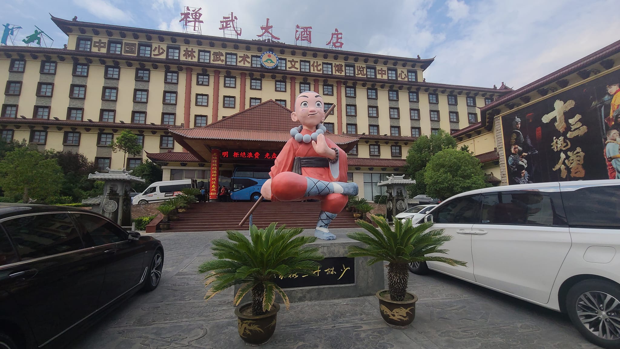 Shaolin Hotel Main Entrance has a huge Carton monk in cross leg stance